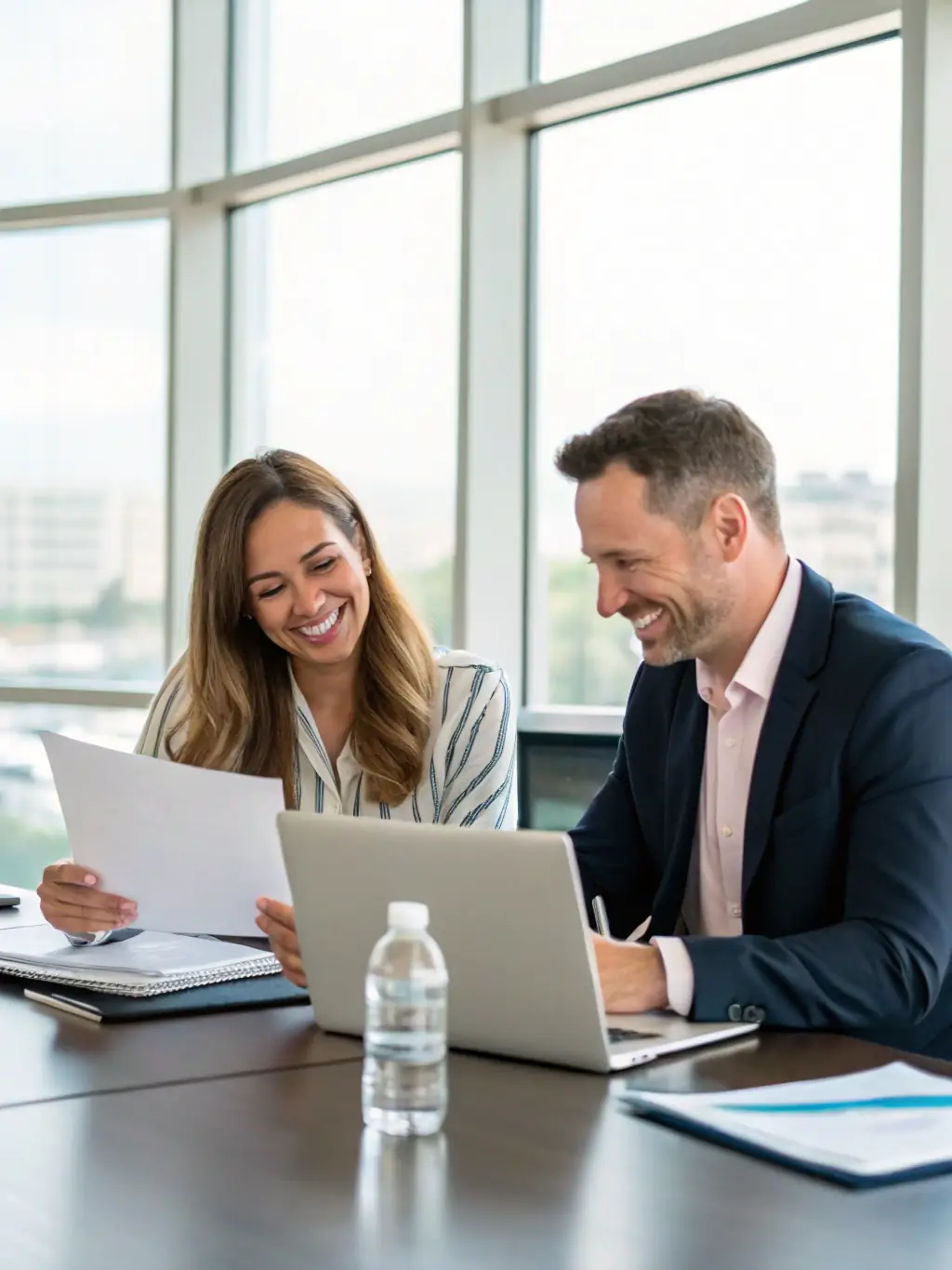 Two film industry professionals in a consultation meeting, discussing project strategies and solutions, illustrating CA Production LLC's consultation services.